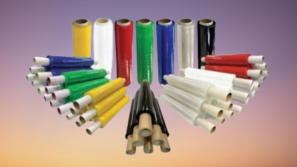 Colorful stretch films standing neatly in a row on table, symbolizing industrial and home packaging solutions